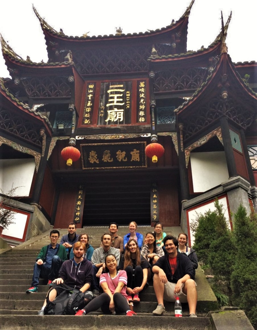 Students sitting in front of a traditional Chinese building during the Cultural Festival in Chengdu, China.