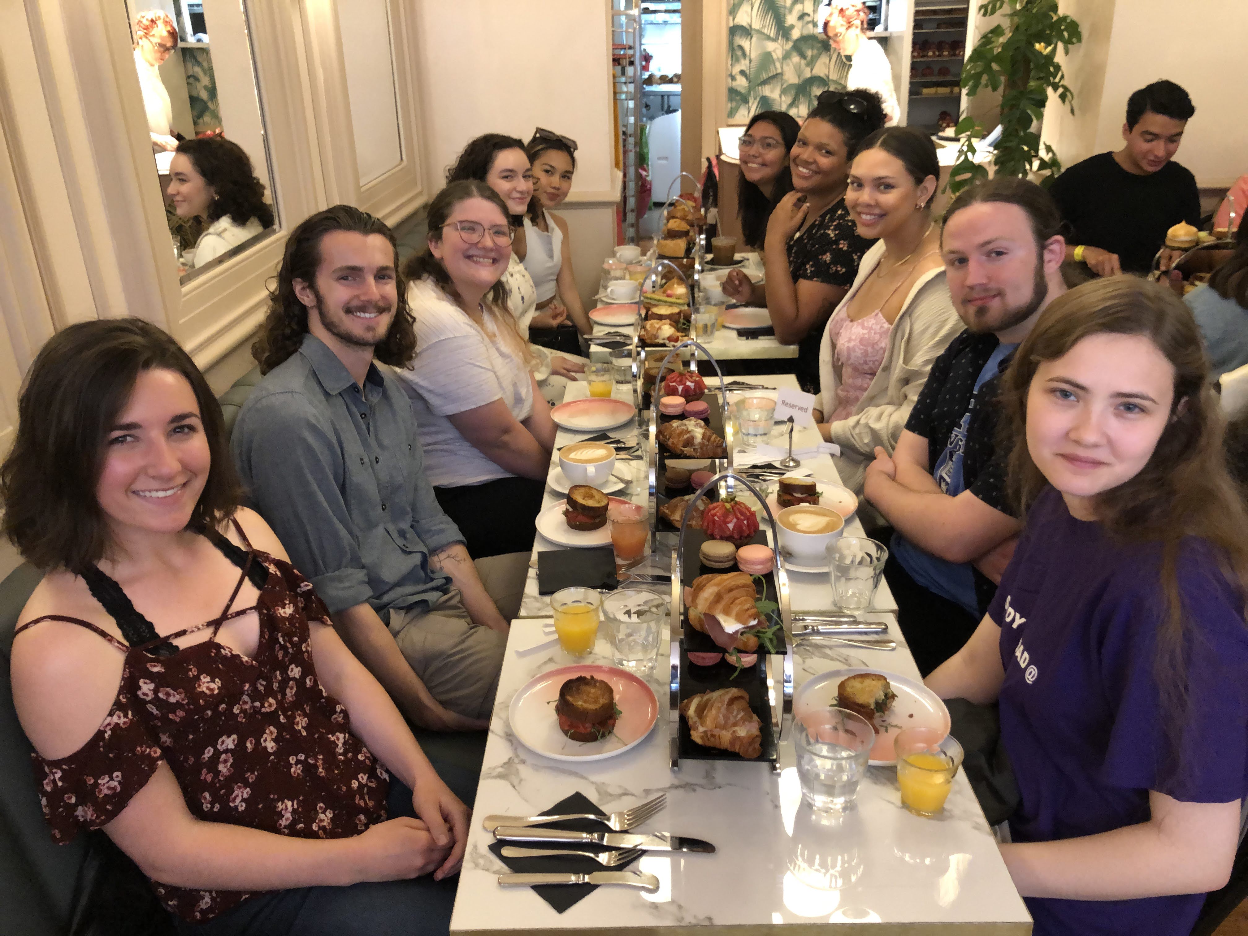 Group of students enjoying afternoon tea in Brighton, England