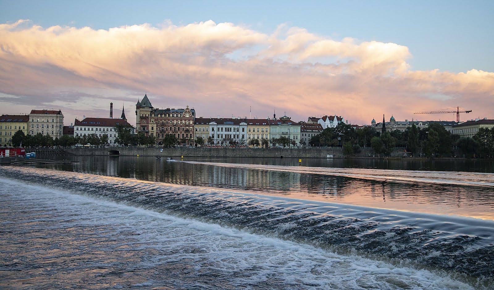 View of historic city from a boat on the river.