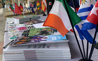 Table with USAC print materials on it at a Study Abroad fair.