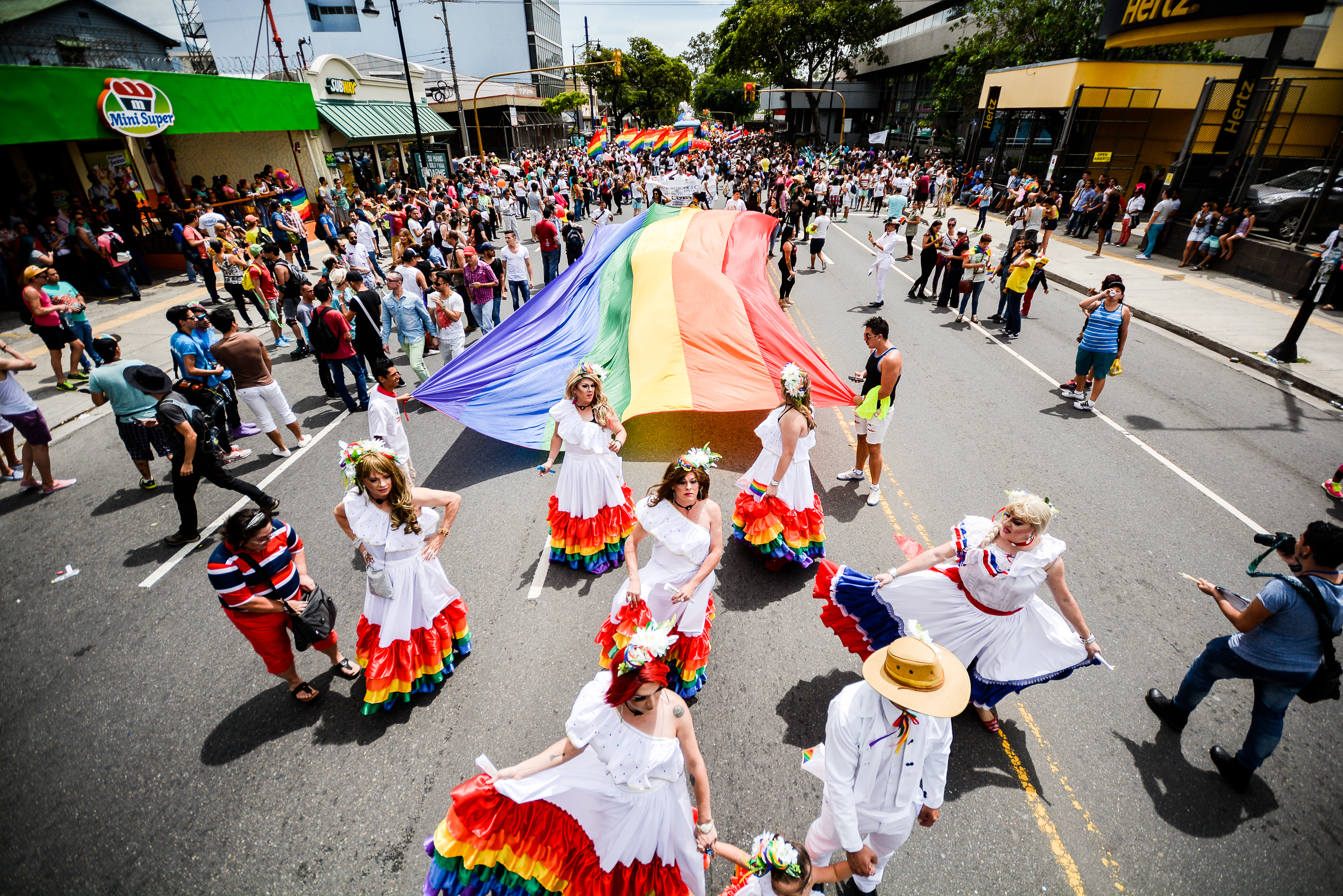 People in traditional Costa Rican dresses dancing at the Pride Parade in San Jose, Costa Rica