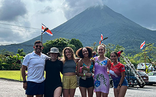 Students with the Arenal Volcano in the background in La Fortuna, Costa Rica.