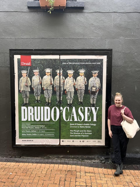 Leanne Howard standing next to a sign that says "Druid O'Casey" while studying abroad in Galway, Ireland.