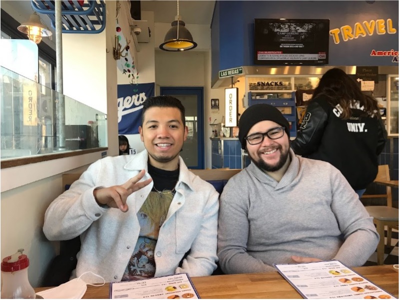 Angelica's brother and friend visiting with her at a restaurant in Gwangju, South Korea.