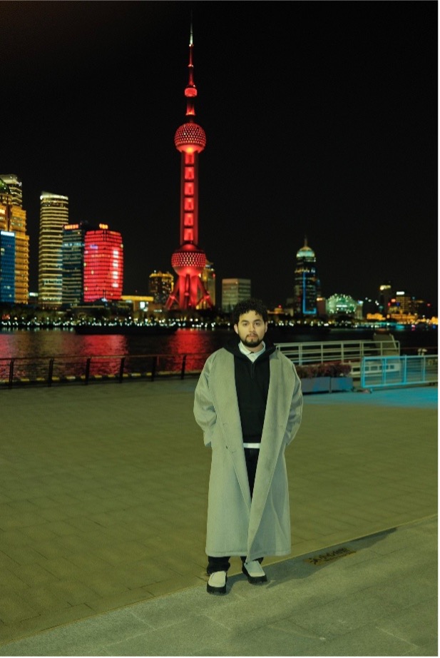 Helton Alvarez with a view of the city of Shanghai, China at night.