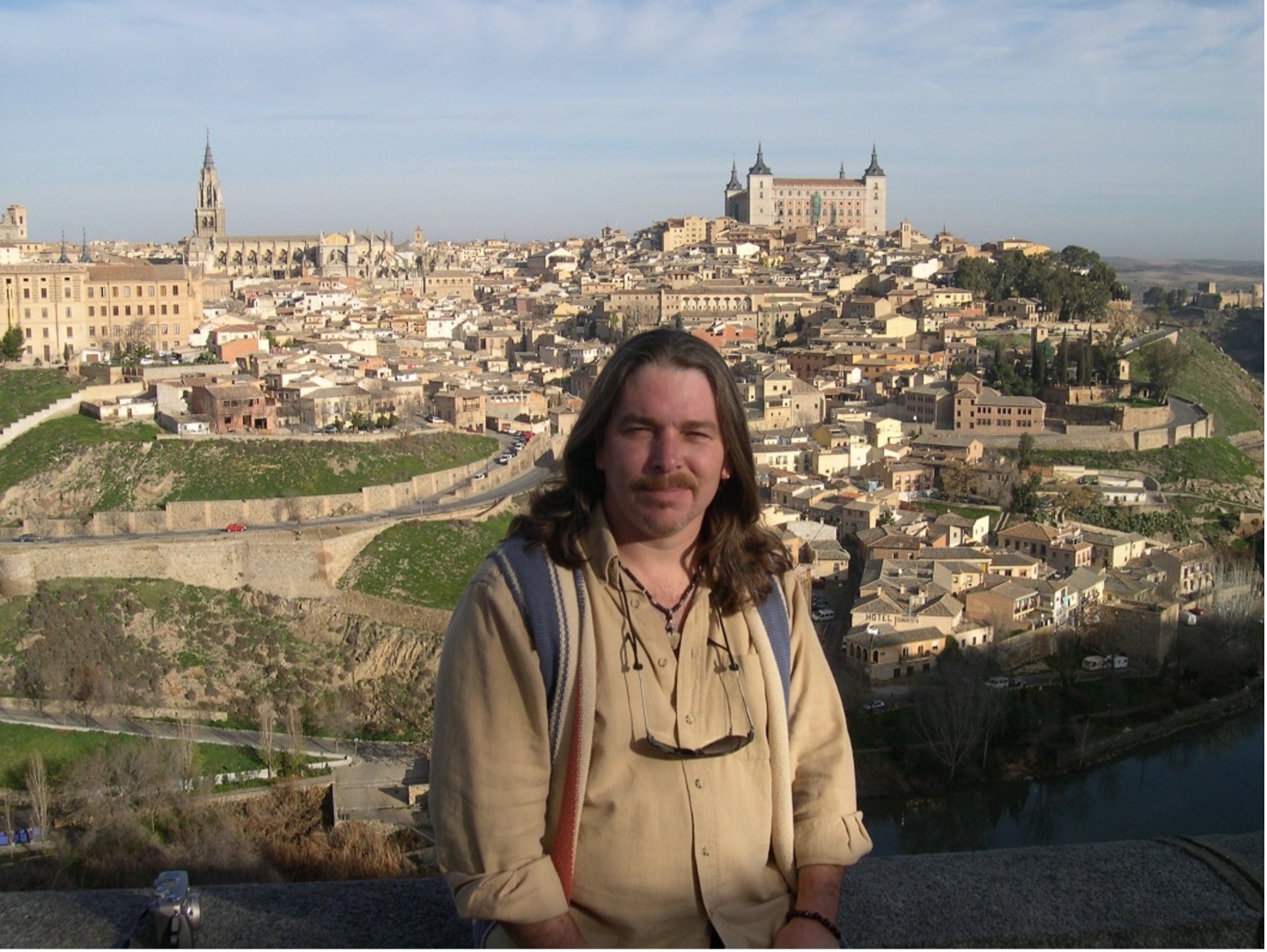 Joel Lippert overlooking historic buildings in Spain.