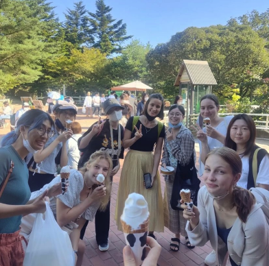 KayCee Carlen eating ice cream with a group of friends in Japan.