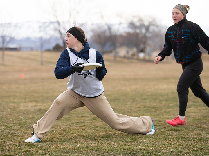 Mary Clingerman playing ultimate frisbee.