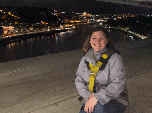 Emily overlooking the city of Porto, Portugal at night.