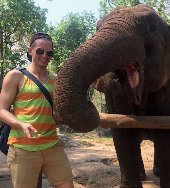 Jonathan helping care for an elephant in Chiang Mai, Thailand.