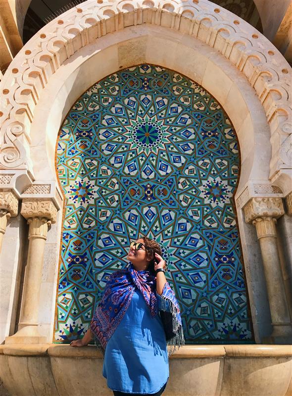 Josie posing in a tiled archway in Morocco. 