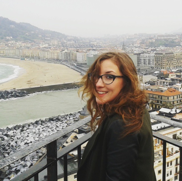 Kelsey overlooking the city and coastline in San Sebastian, Spain.