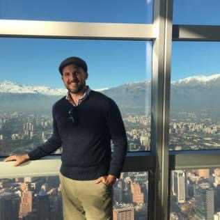 Thomas at an overlook with a view of Santiago, Chile.