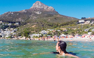 A student swimming in the sea on the coast in South Africa.