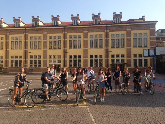 A group of students on bikes in Verona, Italy.