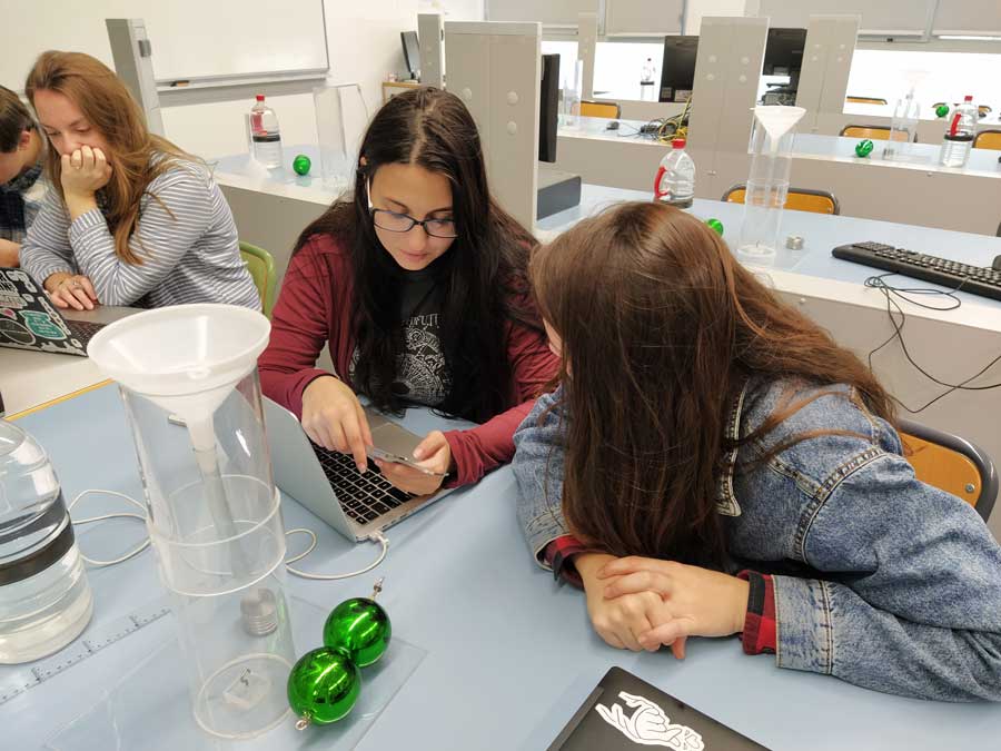 Two students at a table in an Engineering lab class.