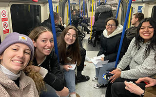 Students travelling by bus in London, England.