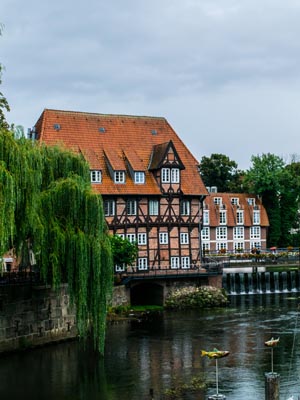 A view of the river and traditional German buildings in Lüneburg, Germany.