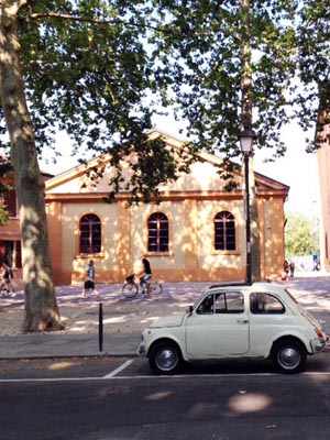 A classic car on the street in Italy.