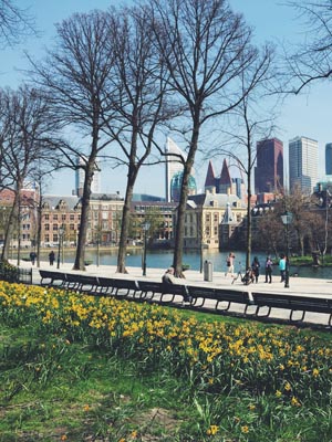 People walking along the river in Maastricht, Netherlands.