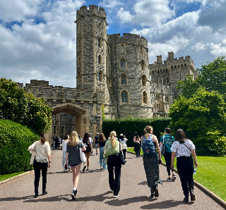 A group of students walking toward Windsor Castle in England.