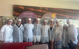 A group of students touring the Lavazza Coffee company in Torino, Italy.