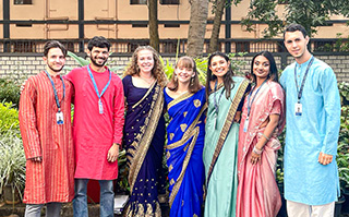 A group of students in traditional Indian attire in Bengaluru, India.