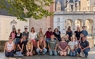 A group of students in front of a historic building in Pau, France.