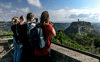 Students at a mountain overlook in Italy.
