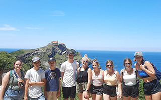Students overlooking the sea in Bilbao, Spain.
