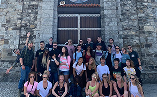 Students in front of a historic building in Bilbao, Spain.