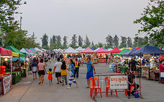People at a market in Khon Kaen, Thailand.