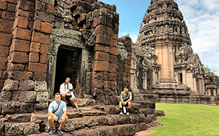 Students at historic ruins in Thailand.