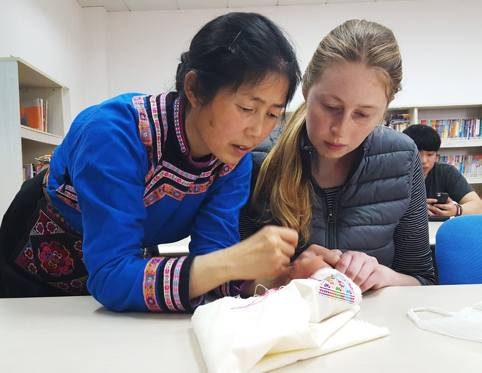 A student learning how to do traditional Qiang Minority embroidery in Chengdu, China.