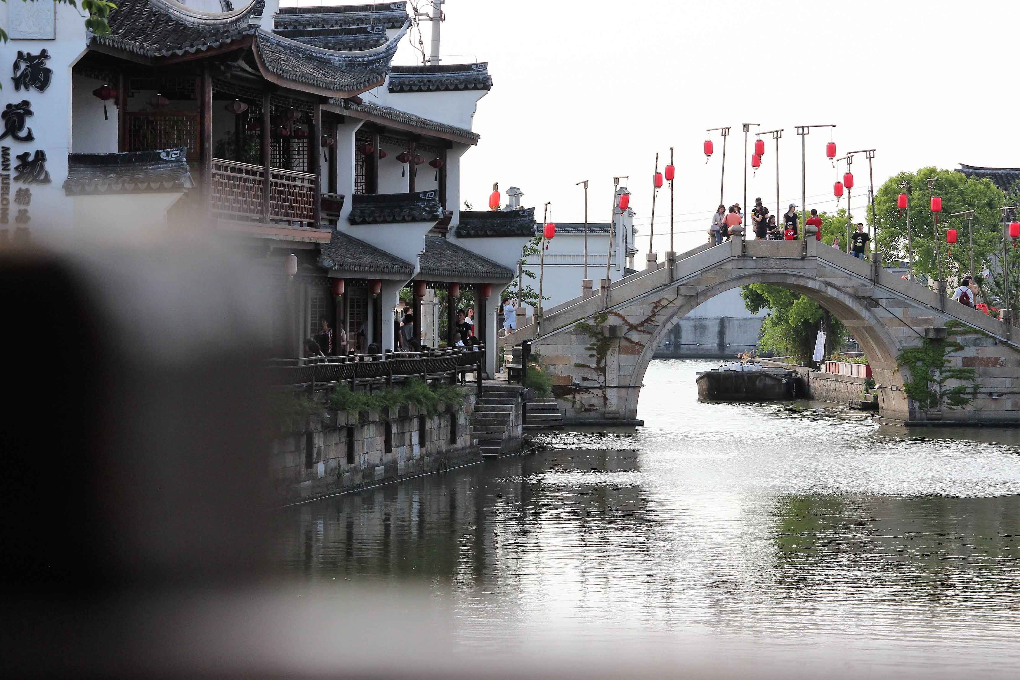 The river and ancient buildings in Xitang, China.