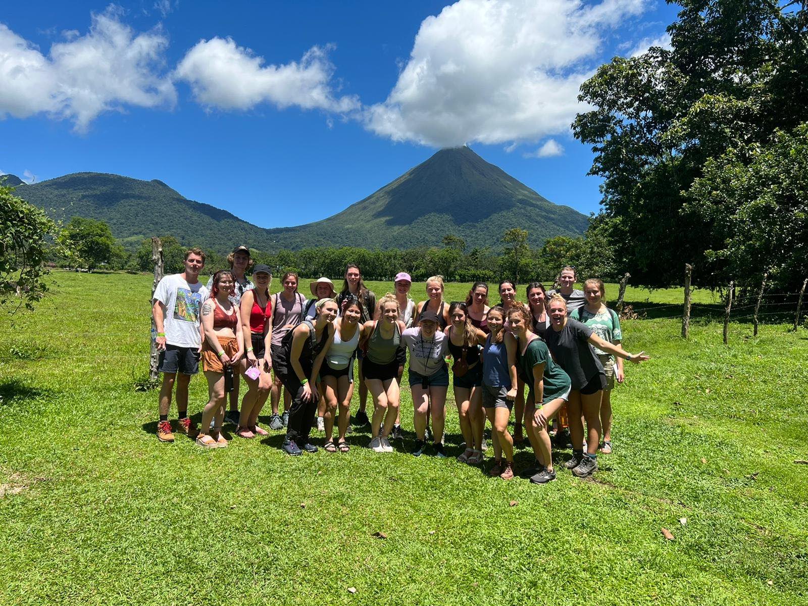 A group of students with the Arenal Volcano in the background in Costa Rica