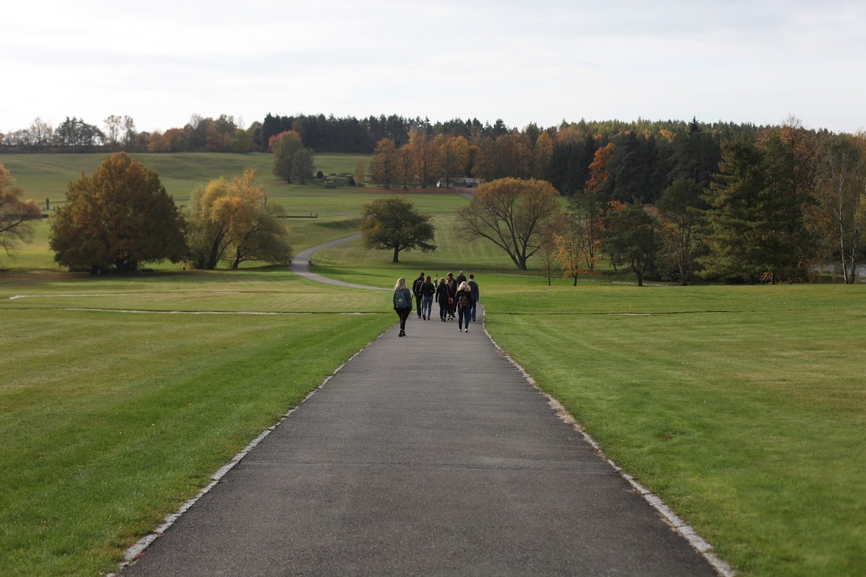 People walking on the path outside the fortress of Terezín in Czech Republic.