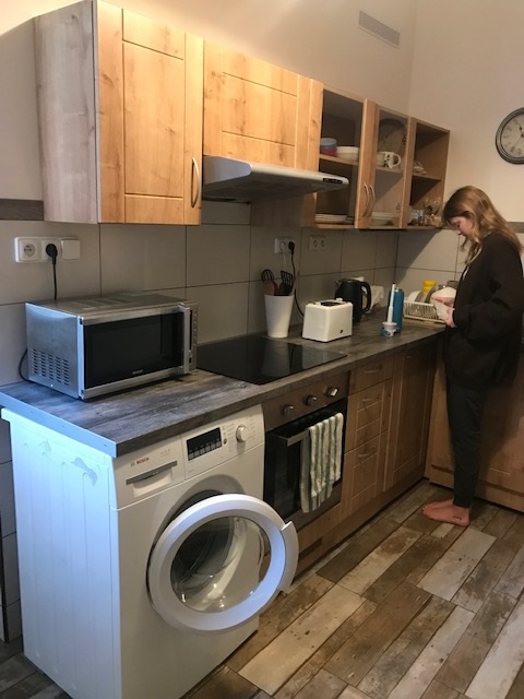 Kitchen and dining area in student apartment in Prague, Czech Republic.