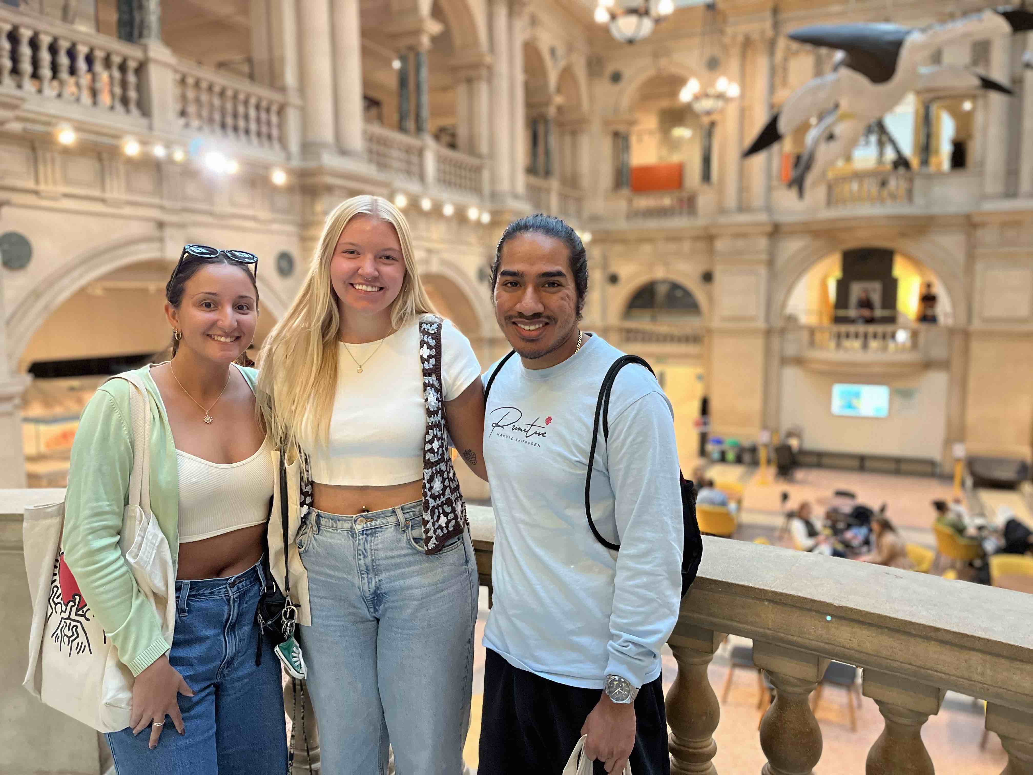 Three students visiting an art gallery in Bristol, England