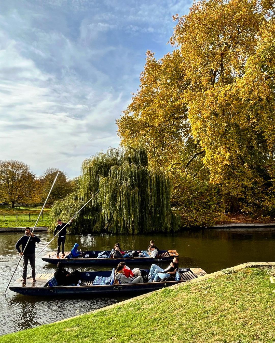 People boating on the River Cam in Cambridge, England.