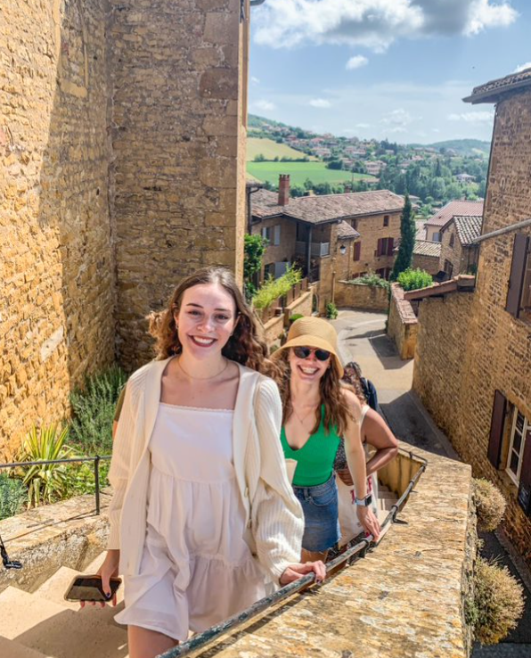 Students exploring the historic streets of Beaujolais, France.