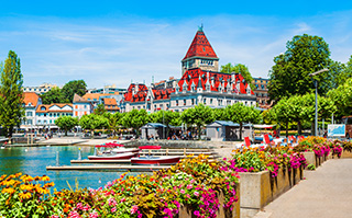 A view of the lake and historic buildings in Geneva, Switzerland.