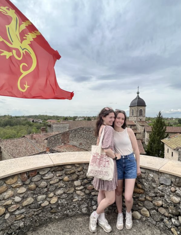 Two students overlooking the historic medieval city of Pérouges, France.