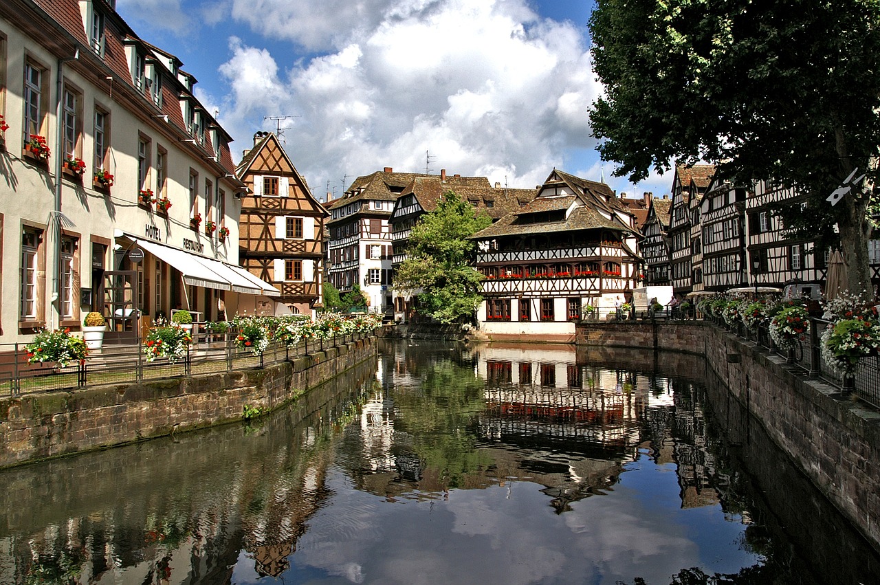 A view of traditional German-style buildings along a canal in Strasbourg, France.