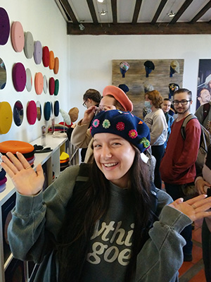 Woman modeling her new Beret at the Beret Museum in France.