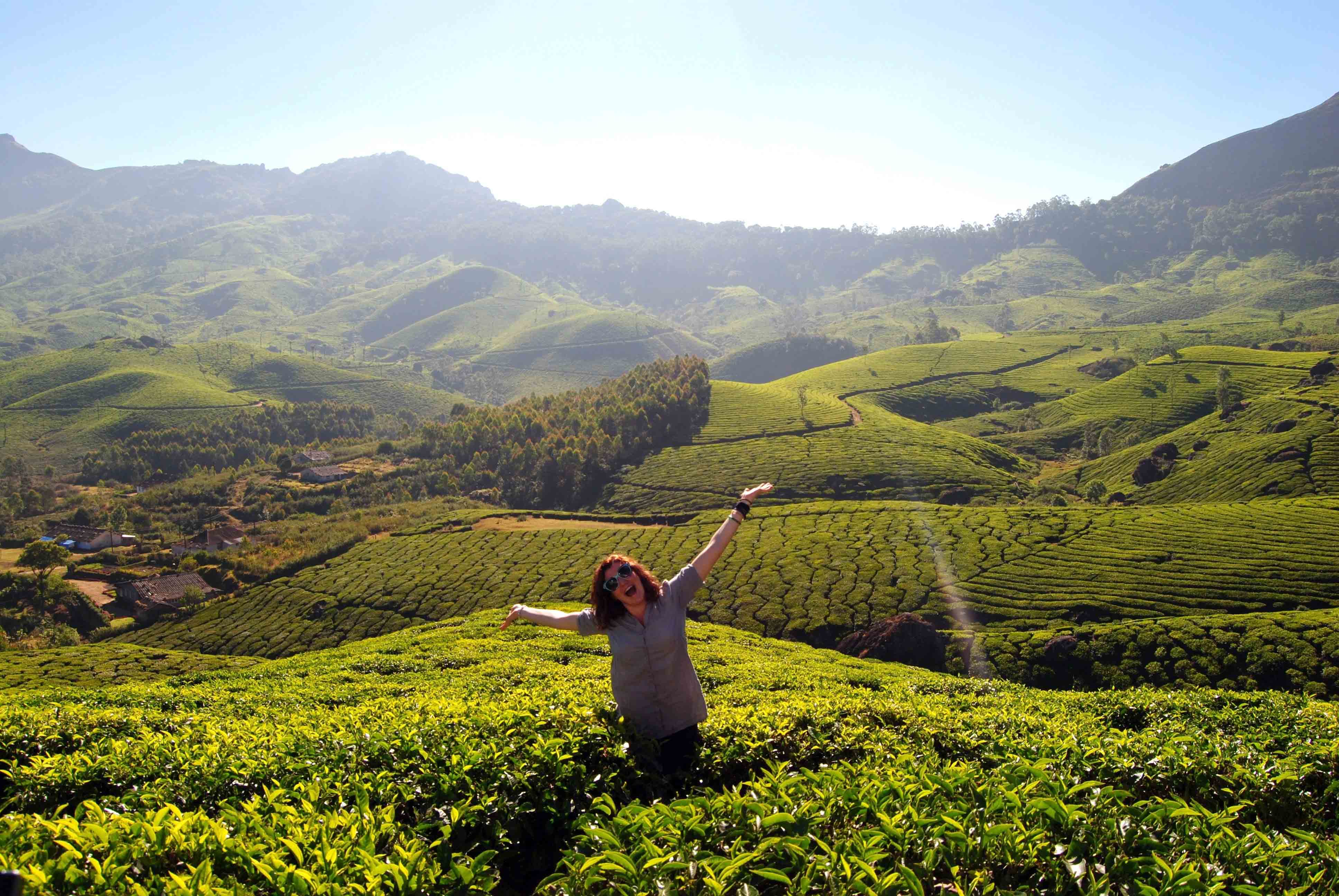 A student standing in the tea fields of Bengaluru, India.