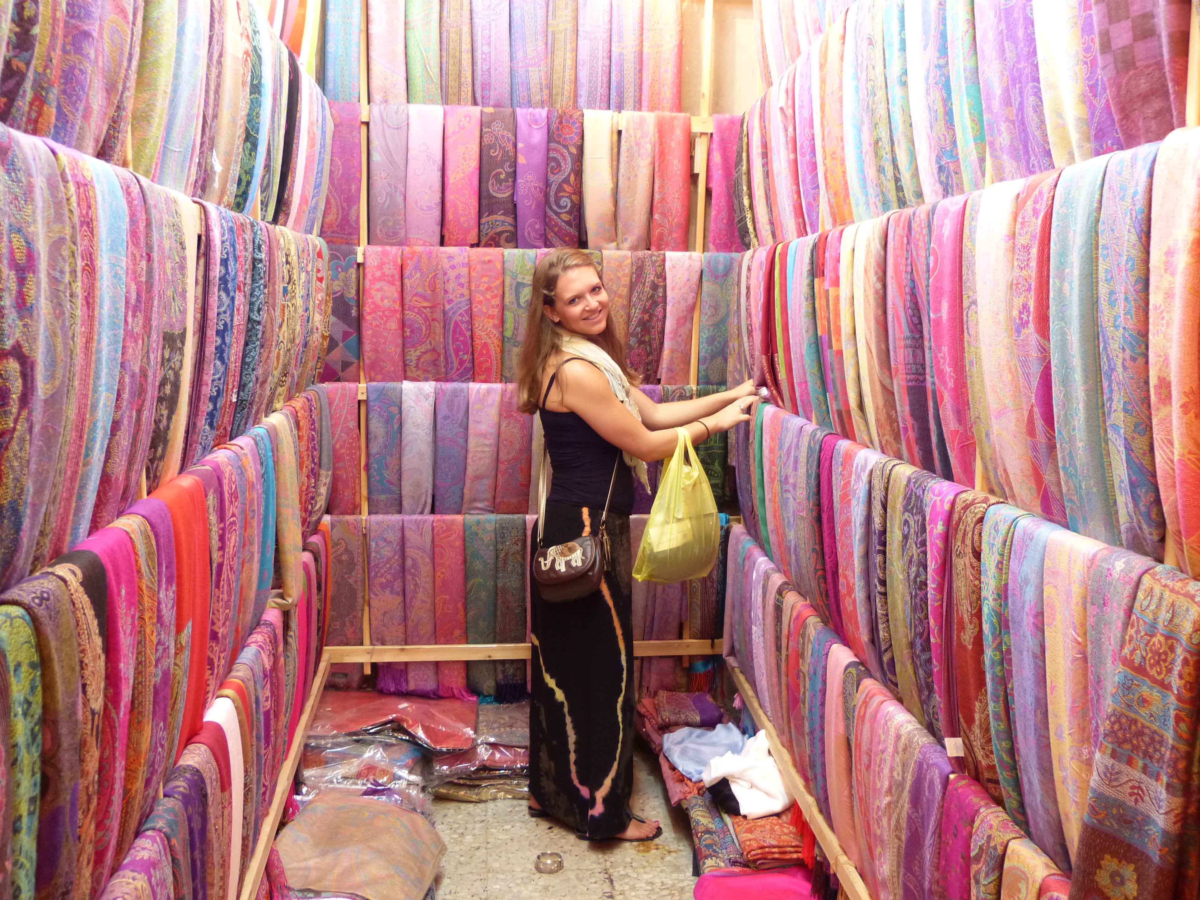 Student checking out the beautiful silk scarves in the market in Haifa, Israel.