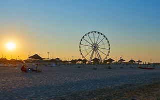 A view of the ferris wheel on the beach in Rimini, Italy.