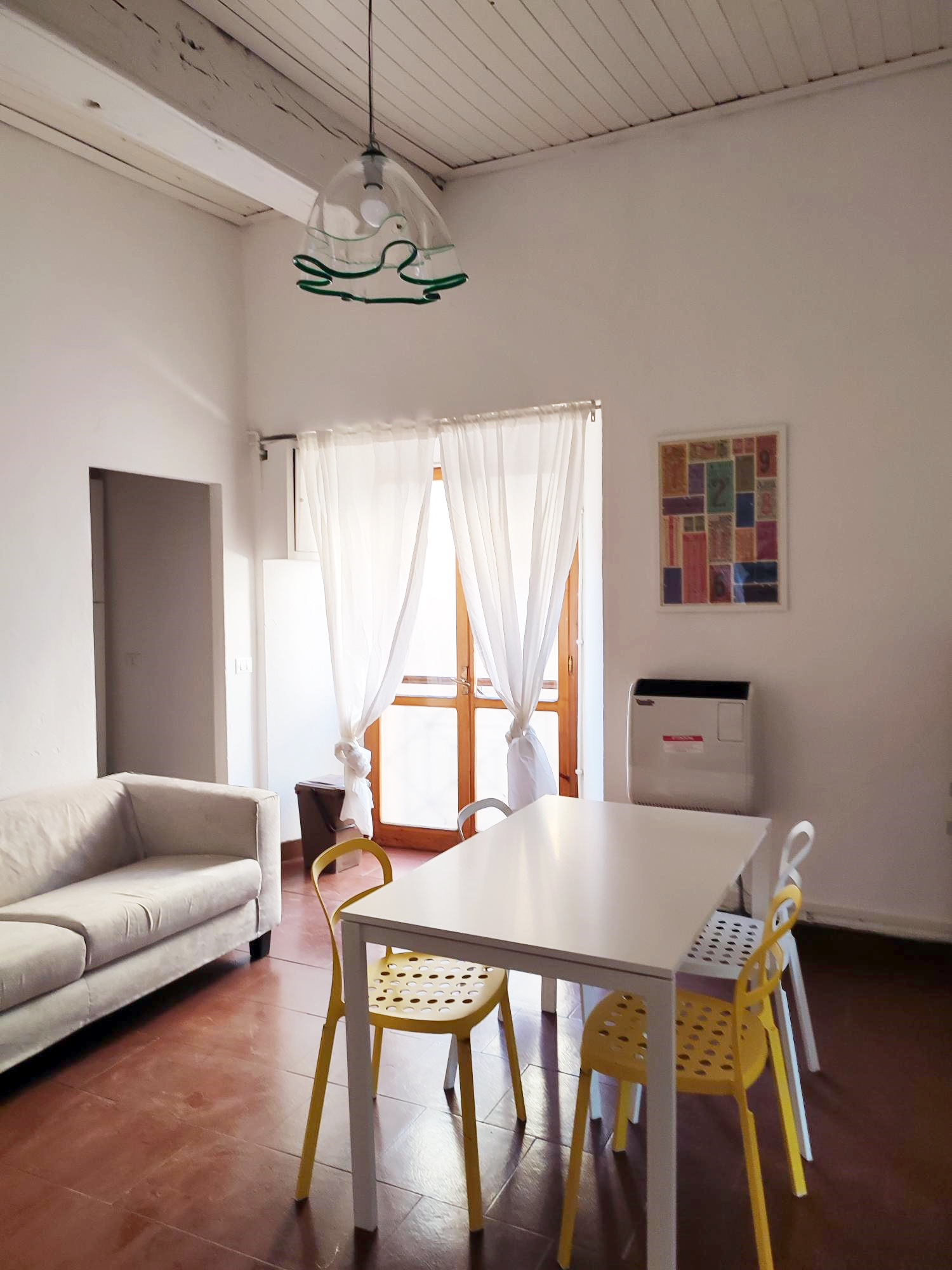 Living and dining area of student apartment in Reggio Emilia, Italy.