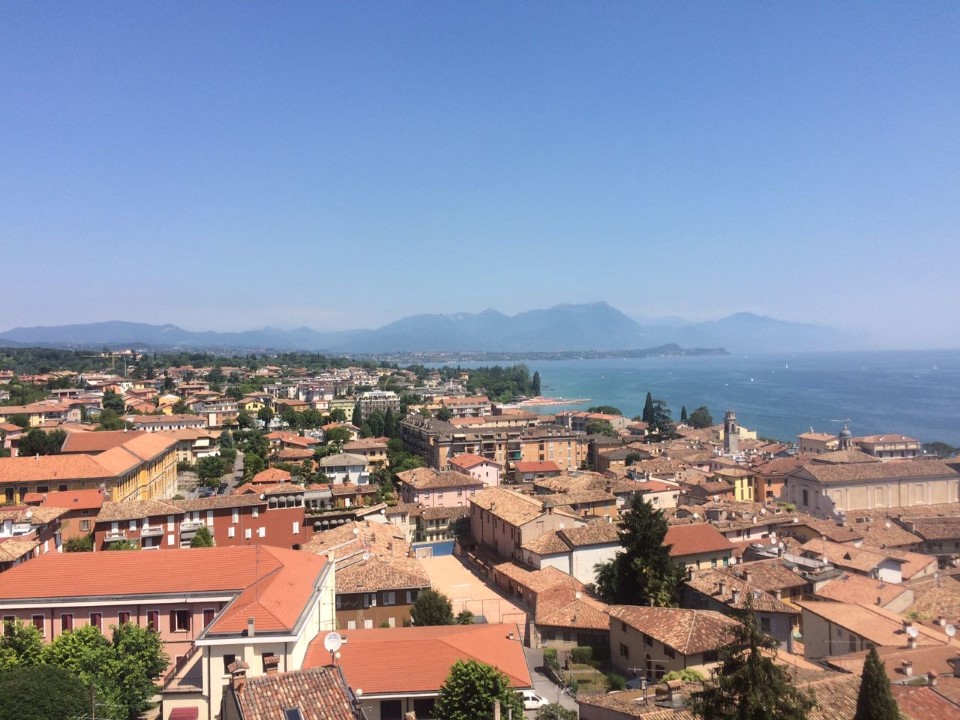 A view of the rooftops and Lake Garda in Italy.